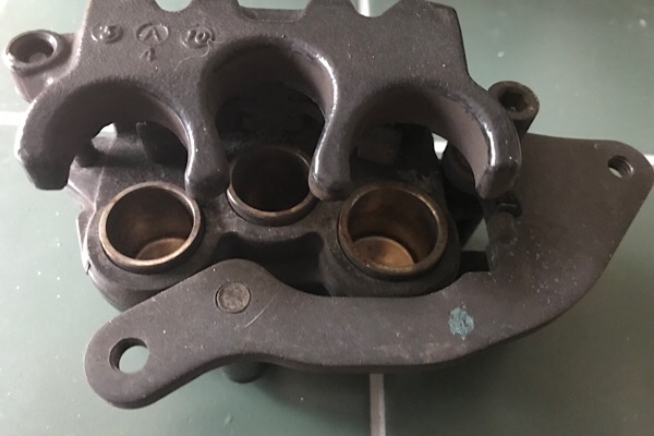 Three piston caliper