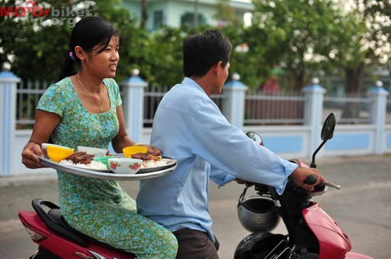 I've heard of breakfast in bed. But on a moped?