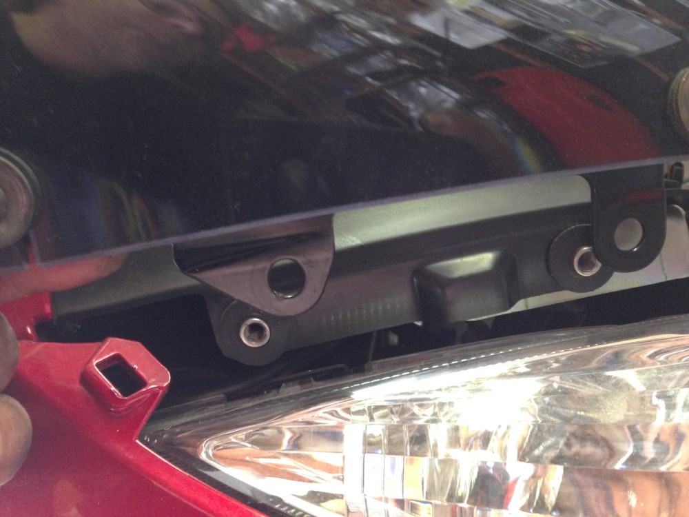 snap the windshield bracket in on the left and right sides